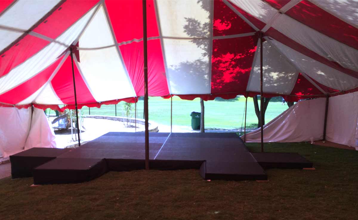 Picture of a stage underneath a tent.