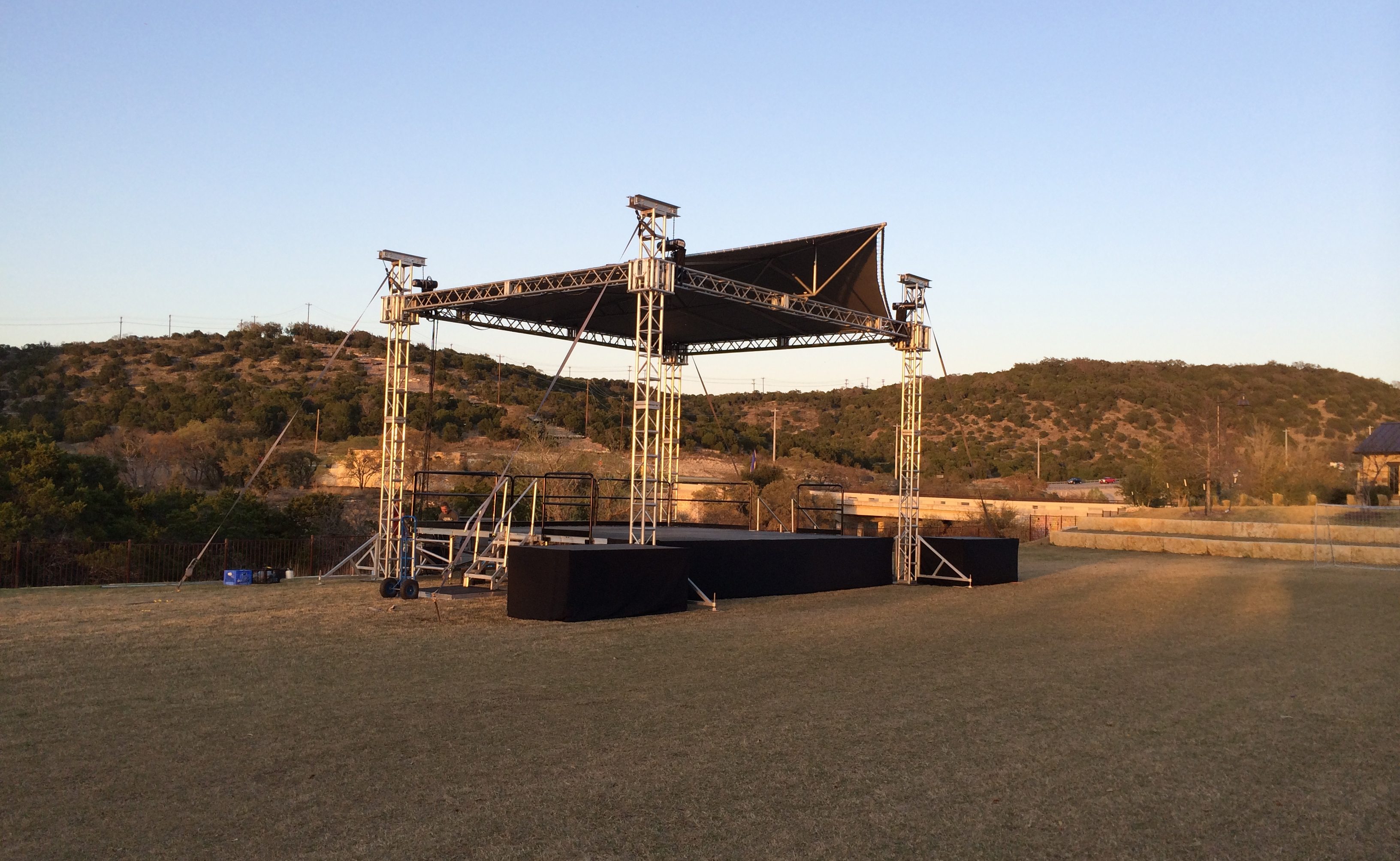 Picture of a stage in a large field.